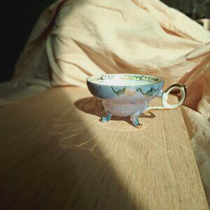 Elegant Antique Iridescent Teacup with 24karat Gold Accents